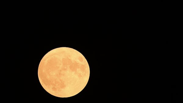 Timelapse of August super blue moon over Lake Harriet in Minneapolis