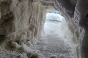 When their St. Paul sidewalk was blocked by a mountain of snow, they dug a tunnel
