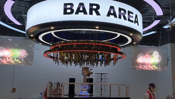 Robotic bartender serves customers at the Beijing Olympics