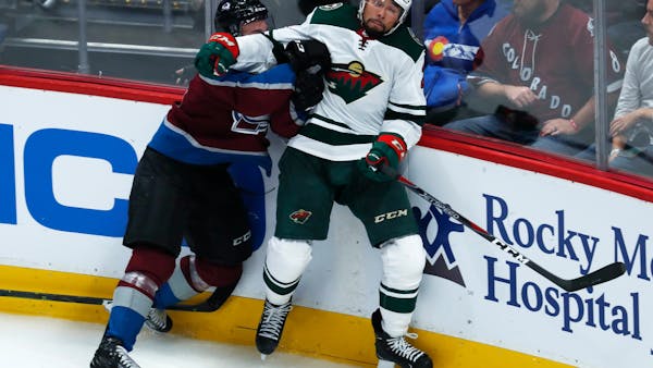 Parise scores but Wild can't control MacKinnon in season-opening loss