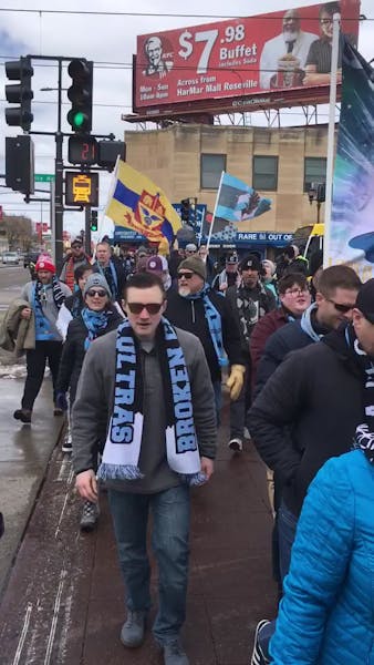 United supporters march to Allianz Field