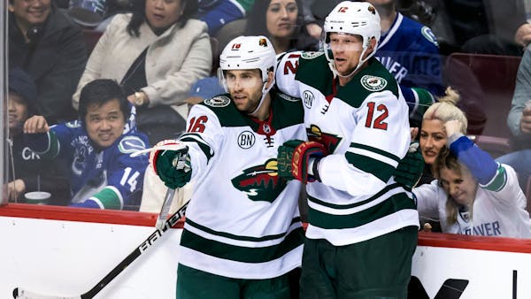 Wild ends losing streak with rally over Canucks