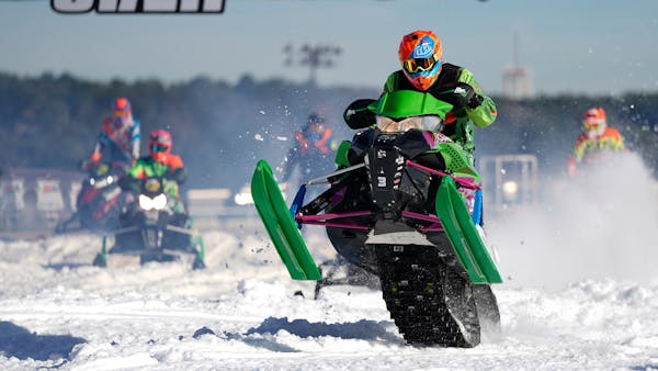 Slo-mo action of Snocross National racers battling it out