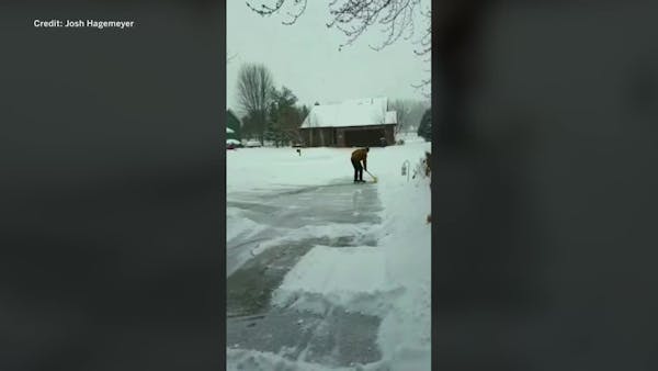 Minnesotan embraces icy weather and shovels driveway on skates