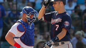 What year is it? Mauer ill at Wrigley, hits a home run (and is expecting Baby No. 3)