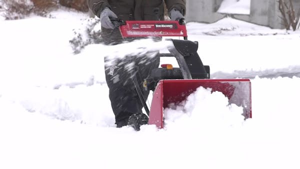 Video: Minnesotans greet snow with shovels and skis