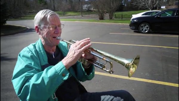 Hudson man plays trumpet in parking lot for nursing home residents