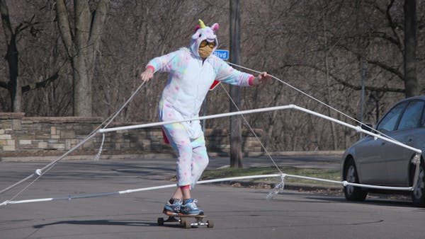 PVC rig, unicorn costume, skateboard = social distancing cone for Mpls. man