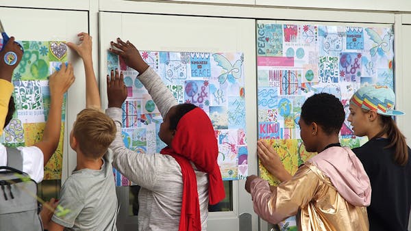 Hopkins middle school celebrates International Day of Peace by wall papering school