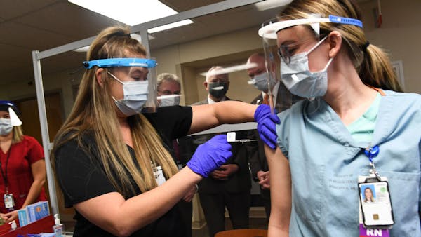 Watch VA nurse receive one of Minnesota's first COVID-19 vaccine doses