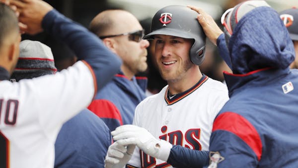 Happy landings: Three homers lift Twins to victory at chilly Target Field