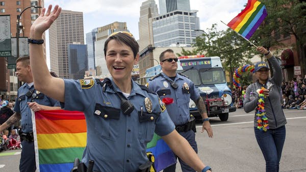 Police officers walk in annual Twin Cities Gay Pride Parade