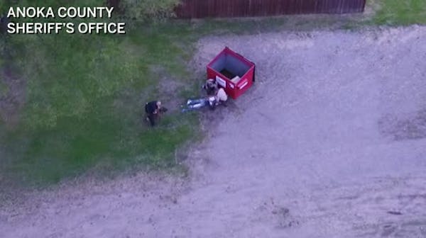 Drone video: Police K-9 attacks handcuffed man