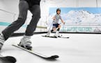 Minnesota skiers defy summer heat on giant indoor treadmill — with fake snow