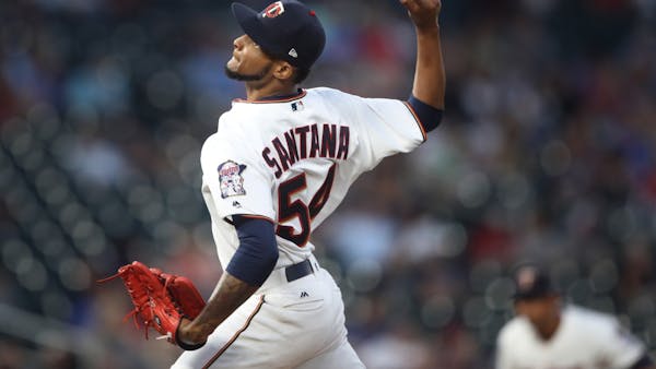 Santana pitches into the seventh inning to get win