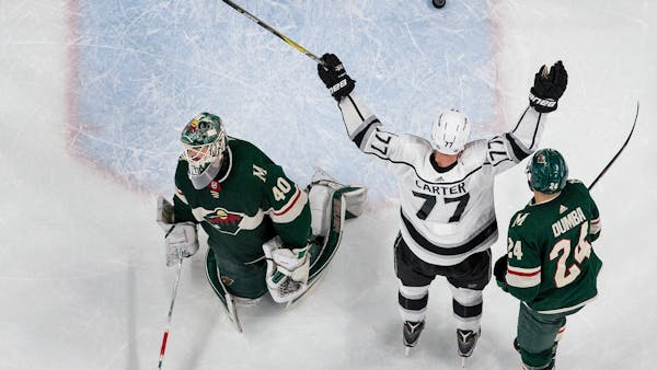 Wild blows late lead, earns point in OT loss to Kings