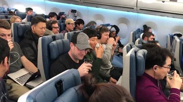 An in-flight toast to curling gold medal winners