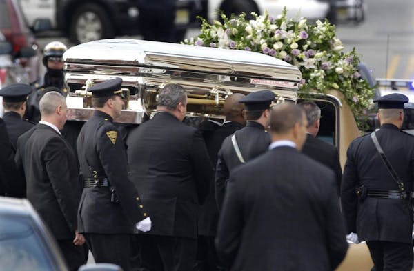 Whitney Houston's voice soars at hometown funeral