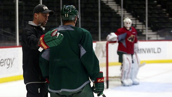 Wild players, coaches hit the ice