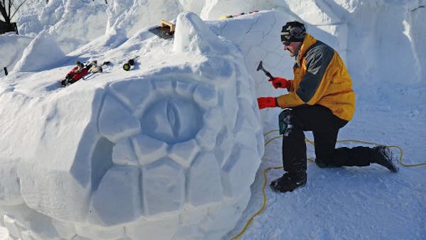 Art emerges from blocks of snow at the Winter Carnival