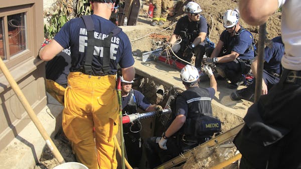 Worker rescued after being pinned under concrete