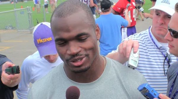 Sidelined: Adrian Peterson reacts