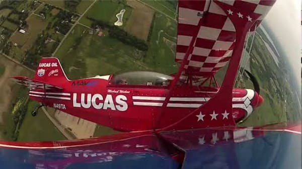 Fly with aerobatic pilot practicing for local air show
