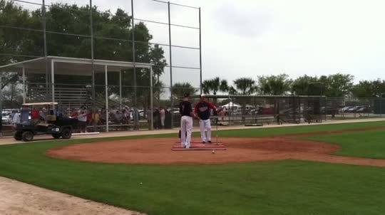 Joe Mauer takes a private lesson from Twins hitting coach Tom Brunansky.