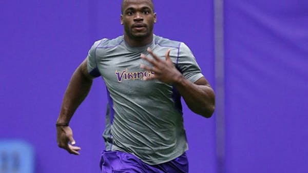 Access Vikings: Peterson works out for the cameras