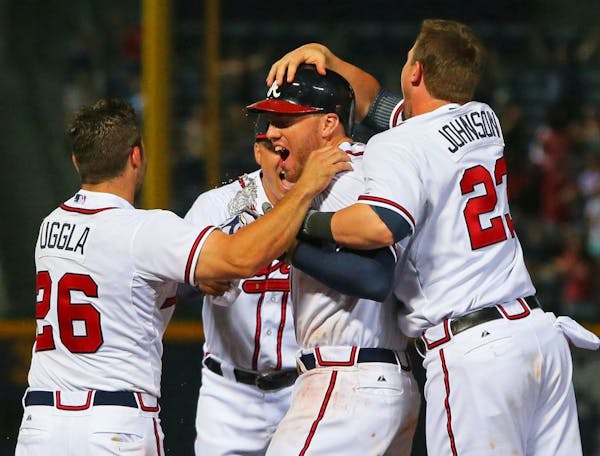 Twins rally in eighth, lose in 10th to Atlanta