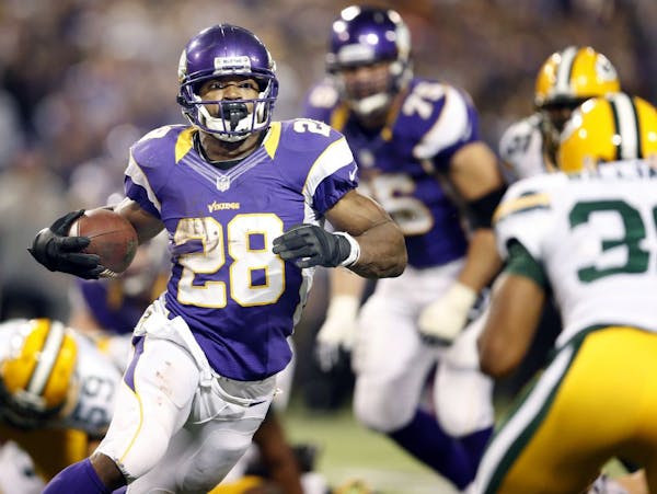 Vikings win encore by beating Pack; Peterson just shy of record