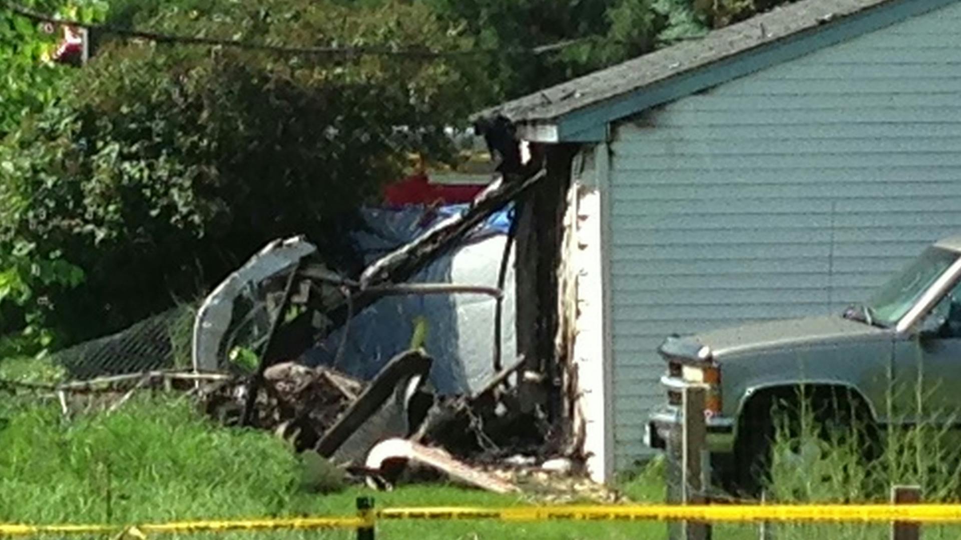 A helicopter crashed into a garage, narrowly missing a house near the Maplewood Nature Center according to witnesses at the scene.