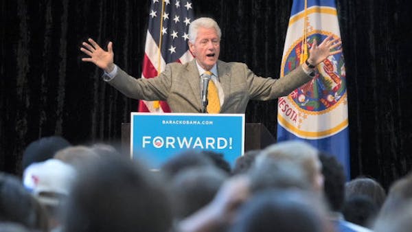 Clinton campaigns for Obama