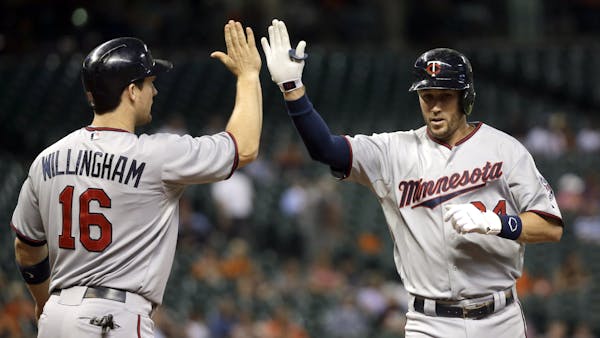 Despite blown lead, Twins rally to throttle Astros in 12