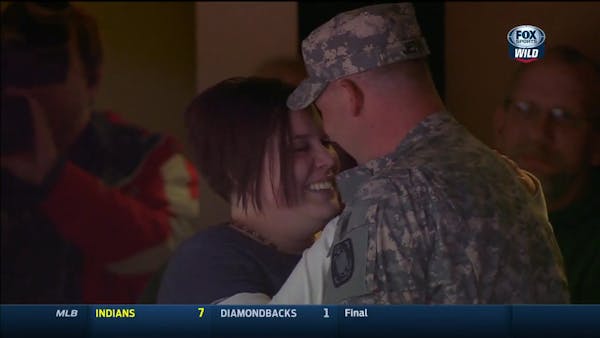 Soldier surprises wife at Wild game