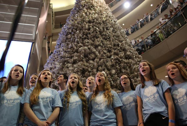 5,000 sing 'Clouds' for cancer research