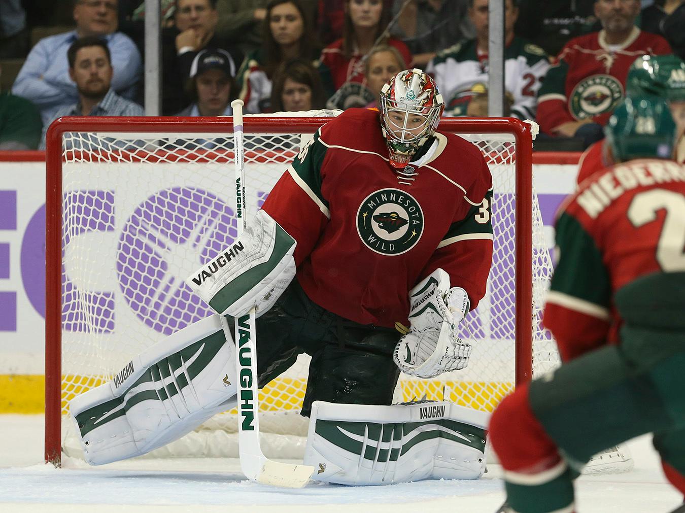 Darcy Kuemper made 26 saves for his third shutout of the season to lead Minnesota past Arizona. Charlie Coyle and Jason Pominville scored for the Wild.