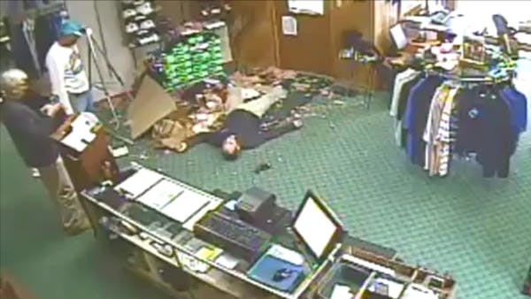 Man nonchalantly falls through ceiling at golf pro shop