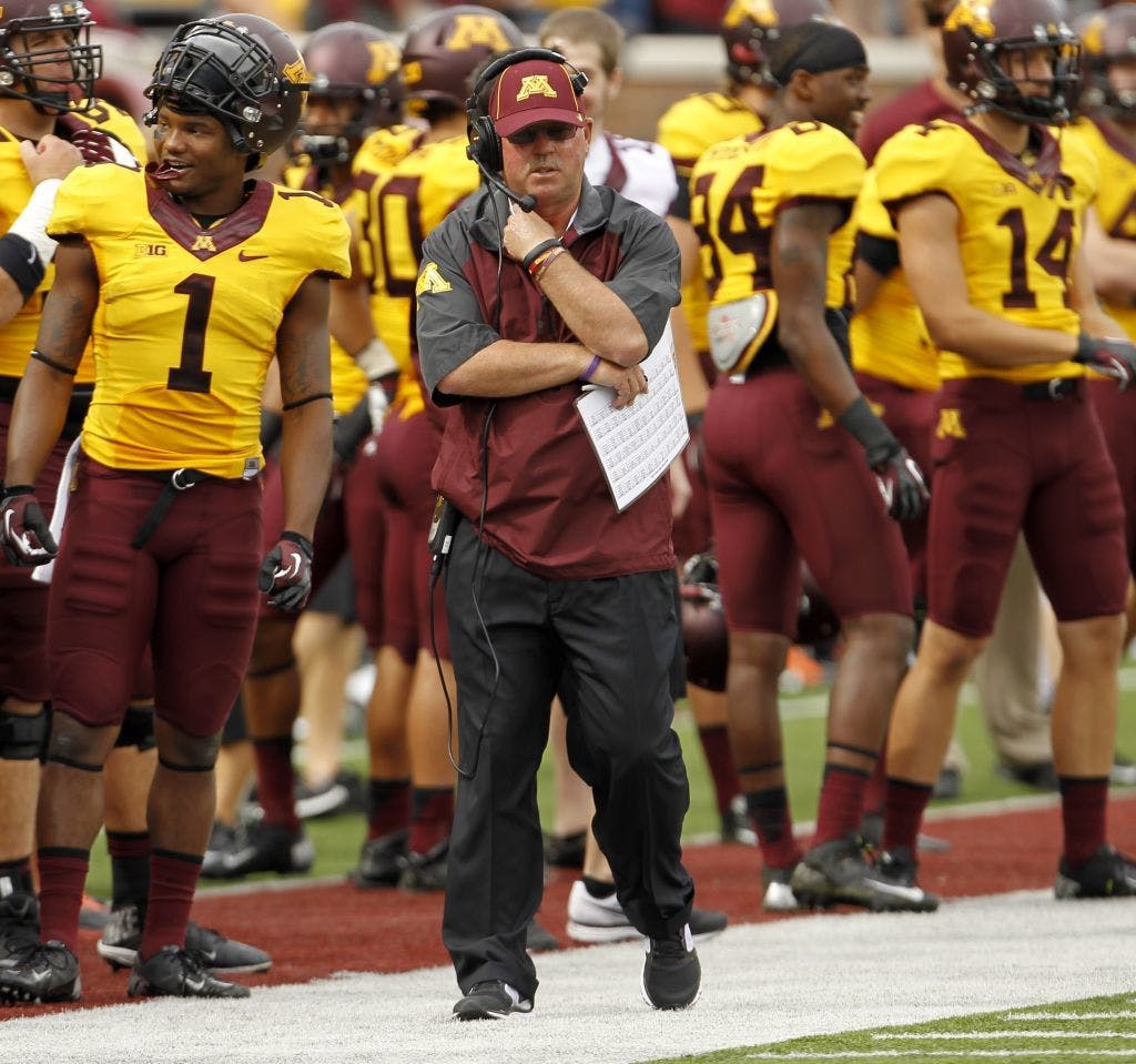 Gophers athletic spokesman Chris Werle reads a prepared statement on the condition of football coach Jerry Kill, who had a seizure at halftime of Saturday's 29-12 victory over Western Illinois.