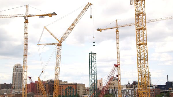 One of the largest cranes in the world goes to work on Vikings stadium