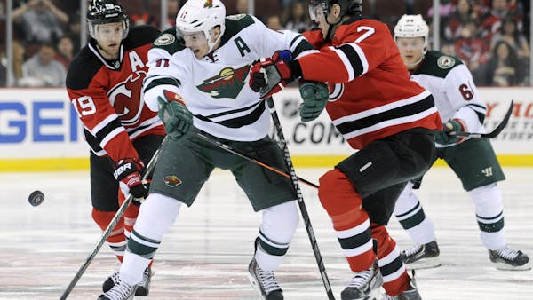 After a slow start, Wild gets a point in OT loss to New Jersey