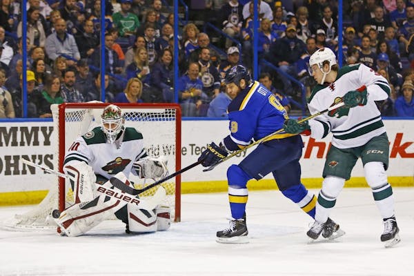 Dubnyk shines again, late flurry of goals lifts Wild over St. Louis
