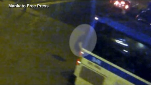 Security camera shows student clinging onto back of bus