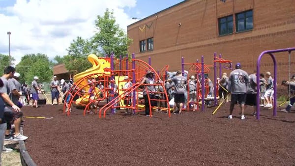Vikings players, staff help build playground