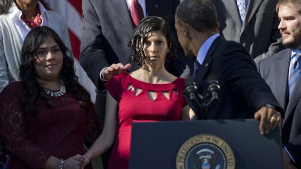 Pres. Obama helps woman during speech