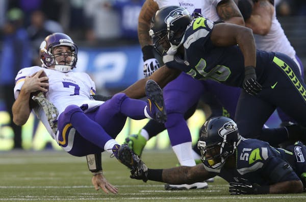 Vikings, quarterbacks get jarred, feathered by Seahawks