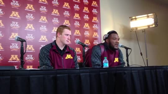 Gophers redshirt freshman Maxx Williams, left, and senior Ra'Shede Hageman talk about seeing coach Jerry Kill leave the game at halftime after suffering an epileptic seizure.