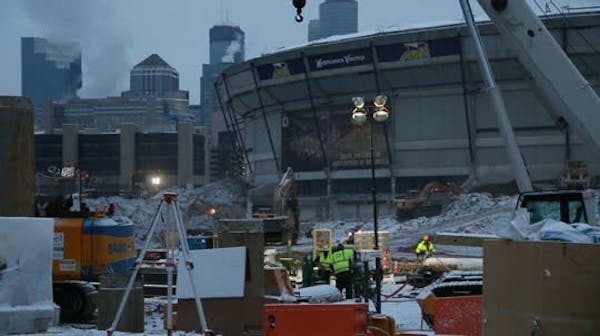 Workers keep it loose at stadium site