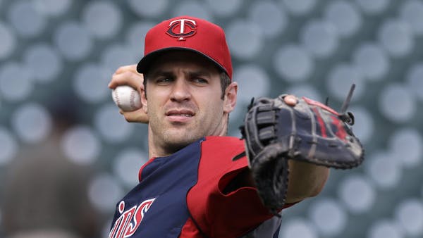 Willing to relocate: Twins' Mauer moves to first base