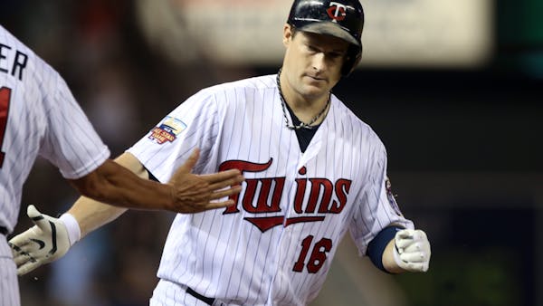 Willingham's homer in eighth powers Twins over Cleveland